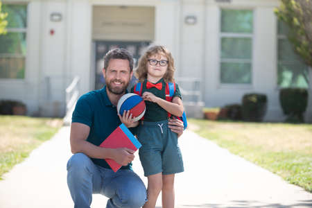 first day at school. father and son come back from school. happy family valueの写真素材