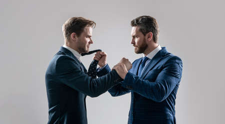 two angry businessmen fighting and arguing on businessmeeting have business competition, leadership.の写真素材