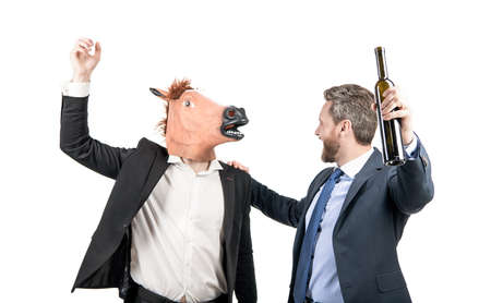 Corporate celebration. Happy businessmen enjoy costume party. Work celebrationの写真素材