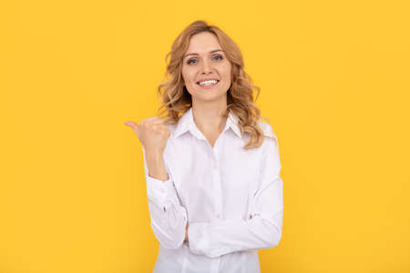 executive assistant or employee. businesswoman. female boss ceo. pointing finger on copy space.の写真素材