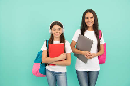 education. pupil and student. mom and teen girl ready to study. private teacher and childの写真素材