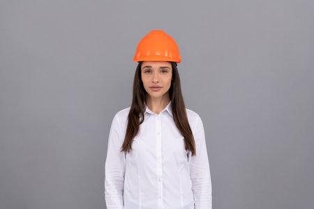 woman worker in white shirt. quality inspector. female construction worker.の写真素材