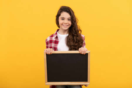 happy kid hold school blackboard for copy space, back to schoolの写真素材