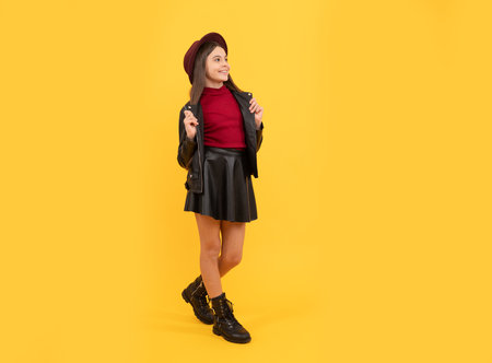 happy teen girl in hat and leather clothes, trendの写真素材