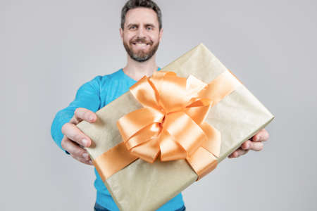surprise for her. valentines day. boxing day. handsome man giving present box.の写真素材