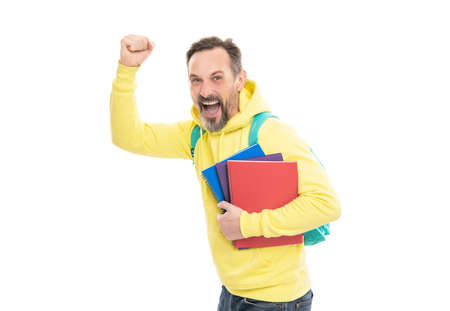 senior guy back to school isolated on white. caucasian man in hoody planning his work. literature education for adult. guy hold workbook. mature happy man carry backpack and notebook.の写真素材