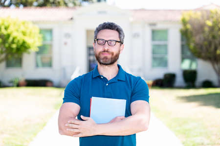 selfish mature teacher nerd looking smart. man in eyeglasses hold paper. vision acuity.の写真素材