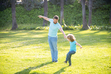 Enjoy every moment. Happy family enjoy summer outdoors. Playful father and son. Family funの写真素材