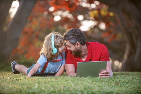 happy family blogging. childhood and parenthood. happy boy listen music in headphones.の写真素材