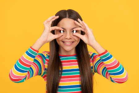 girl hold multivitamin. healthy lifestyle. childhood health. food supplement.の写真素材
