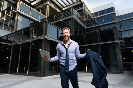man expressing happiness. professional bearded ceo celebrating success.の写真素材