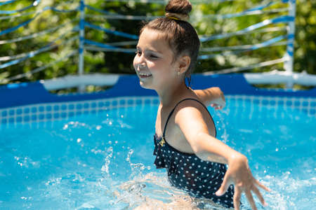 Swimming is my happy hour. Happy child swim in swimming pool. Leisure and recreationの写真素材