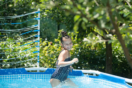 Its a fun time. Happy child have fun in pool. Chill pool day. Summer vacation. Summertime.の写真素材