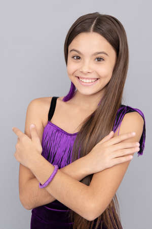 Beauty look of tween fashion model in trendy wear happy smile keeping arms crossed grey background, vogue.の写真素材