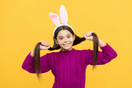 in playful mood. easter bunny hunt. just having fun. ready for party. happy childhood.