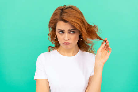 upset female fashion model. pretty look of young girl. portrait of redhead ladyの写真素材