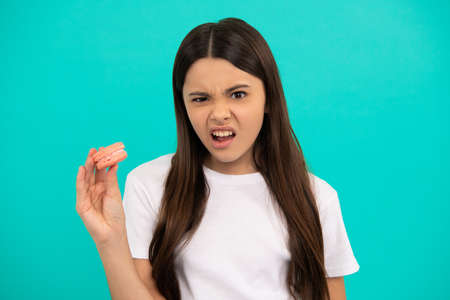 I dont like it. teen girl dental care. she does not like it. patisserie biscuits.の写真素材