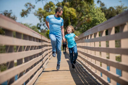 dad with kid on summer day. parenting and fatherhood. fathers day. happy father and sonの写真素材
