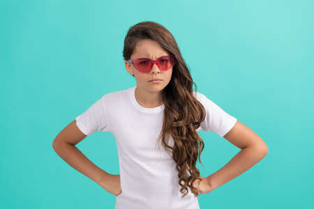 casual summer style. childhood. fancy party look. angry funny kid in red eyeglasses.の写真素材