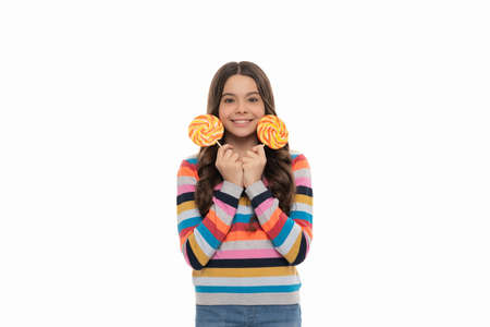 happy kid in colorful sweater with lollipop candy on stick isolated on white background, sweetの写真素材