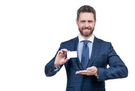 look over there. happy handsome boss man presenting product, copy space. businessmanの写真素材
