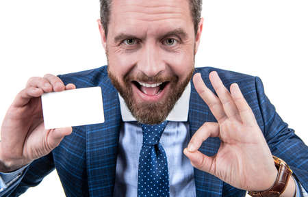 happy businessman man in businesslike suit showing empty debit or business card for copy spaceの写真素材