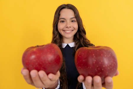 detox. selective focus. happy teen girl with apple fruit. vitamin and dieting.の写真素材