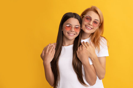 happy family portrait of lovely mother and daughter in glasses, familyの写真素材