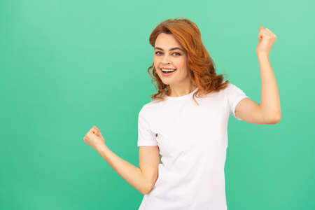 having fun. happy woman with curly hair dancing. beauty and fashion. female fashion modelの写真素材