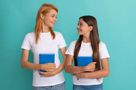 happy school pupil and student holding books, schoolの写真素材