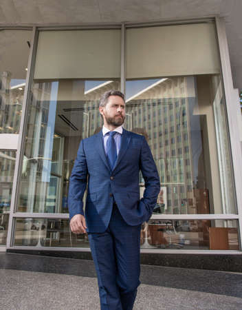 business success. successful man in businesslike suit. entrepreneur outside the office. male formal fashion. professional unshaven ceo. mature businessperson in formal suit.の写真素材