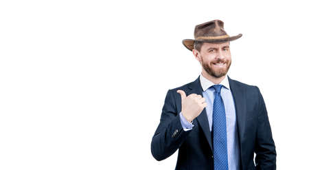 Look at this. Advertising man point finger aside. Advertising expert in cowboy hatの写真素材