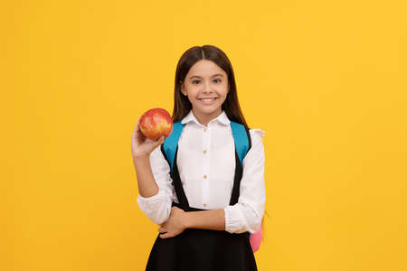 Knowledge day is here. Happy girl smile holding apple. Knowledge day. Food educationの写真素材