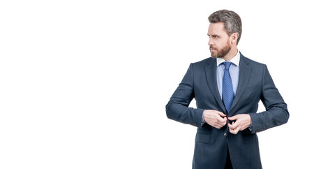 Dress for success. Businessman adjust formal suit. Suited man. Wearing business suitの写真素材