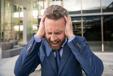 mature bearded boss portrait. frustrated businessman in formalwear. business failureの写真素材