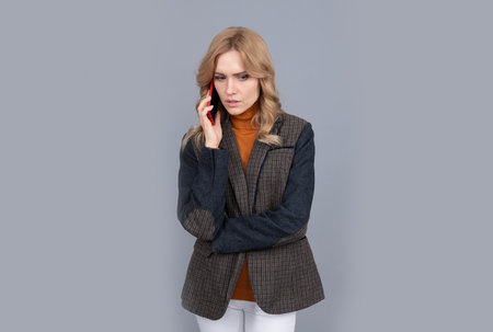 Organize your life. Serious woman talk on cellphone. Making phone call. Telephone callの写真素材