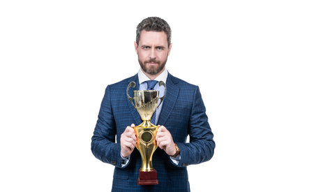 Senior manager in formal suit hold golden cup for business success isolated on white, trophyの写真素材