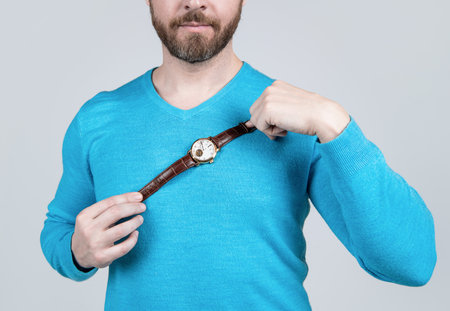 cropped guy with hand watch. business professional dress code. shop assistant showing wristwatch.の写真素材