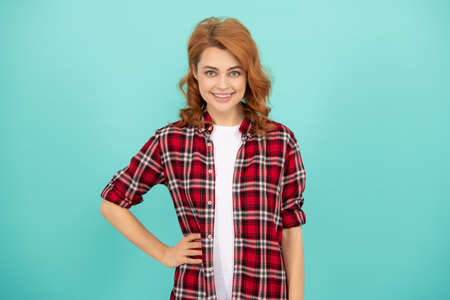 cheerful lady with curly hair. beauty and fashion. female model in checkered shirt.の写真素材