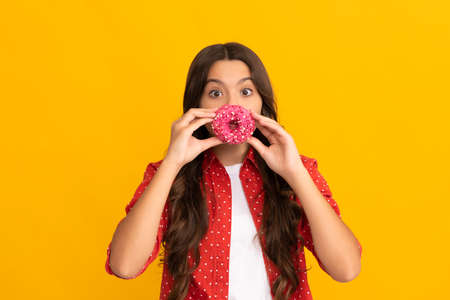happy child having fun with sweet glazed donut, foodの写真素材