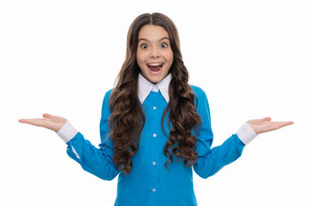 presenting product on copy space. amazed kid with curly hair. beauty and fashion.の写真素材