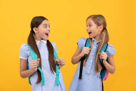 Surprised school friends on September 1 yellow background, friendshipの写真素材