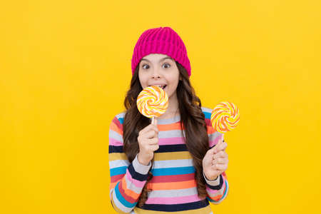 happy kid girl hold lollipop sweet, carefreeの写真素材