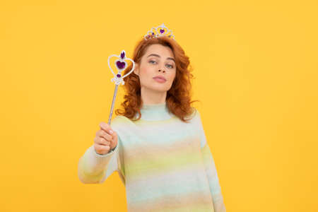 arrogance and selfishness. make a wish. fairy godmother. redhead woman in crown.の写真素材