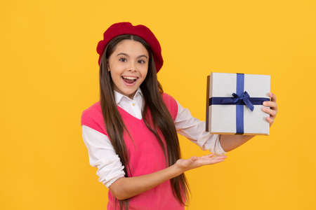 boxing day. cheerful kid in beret. smiling child has birthday. teenage beauty go shopping.の写真素材