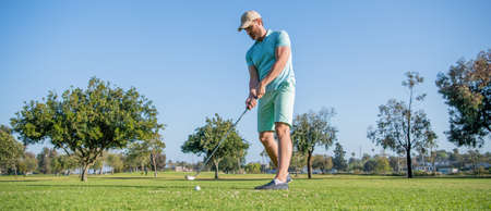 full length portrait of golfer in cap with golf club, sportの写真素材