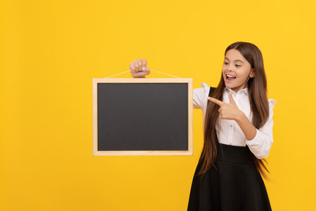 child advertising. back to school. kid presenting novelty information. childhood educationの写真素材