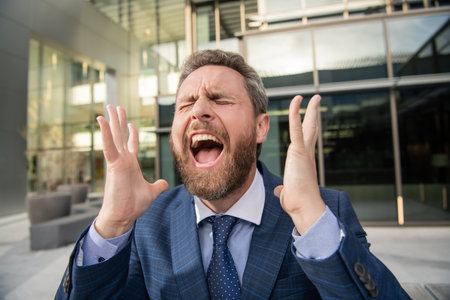 frustrated man in businesslike suit. manager executive express emotions.の写真素材