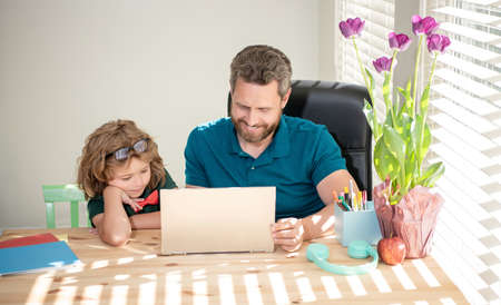 boy do homework with private tutor. webinar video lesson. online education on laptop.の写真素材