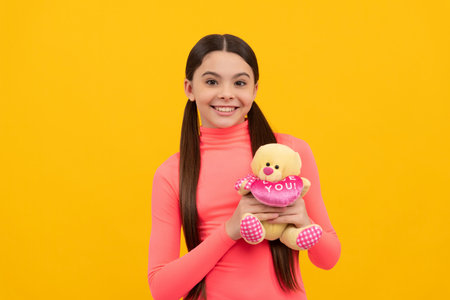 happy valentines day. be my valentine. cheerful kid hold bear toy. toy shop concept.の写真素材